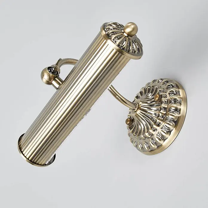 Lindby Wandleuchte Joely - bronze / altmessing, bronze / altmessing, E14 - Verstellbare Wandleuchte aus antikem Messing mit gerilltem Zylinderkopf und verziertem Sockel.