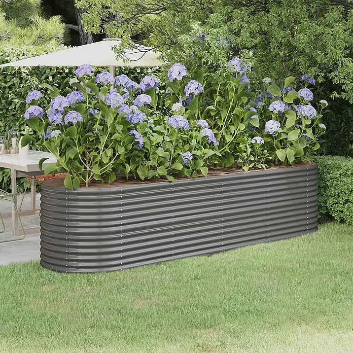 Furnicato Hochbeet - 296 x 80 x 68 cm, Stahl, Grau - Dunkelgraues Wellblech-Hochbeet mit blauen Hortensien, im Garten neben einer Terrasse.