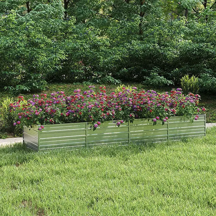 Furnicato Hochbeet - 320 x 80 x 45 cm, Stahl, Silber - Rechteckiges, geripptes Hochbeet aus verzinktem Stahl, gefüllt mit lebhaften pinken und roten Blumen in einem Garten.