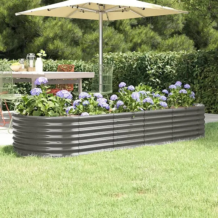 Furnicato Hochbeet - 224 x 80 x 36 cm, Stahl, Grau - Dunkelgraues Hochbeet aus Wellblech, mit lila Blumen gefüllt, auf einem Rasen im Garten.
