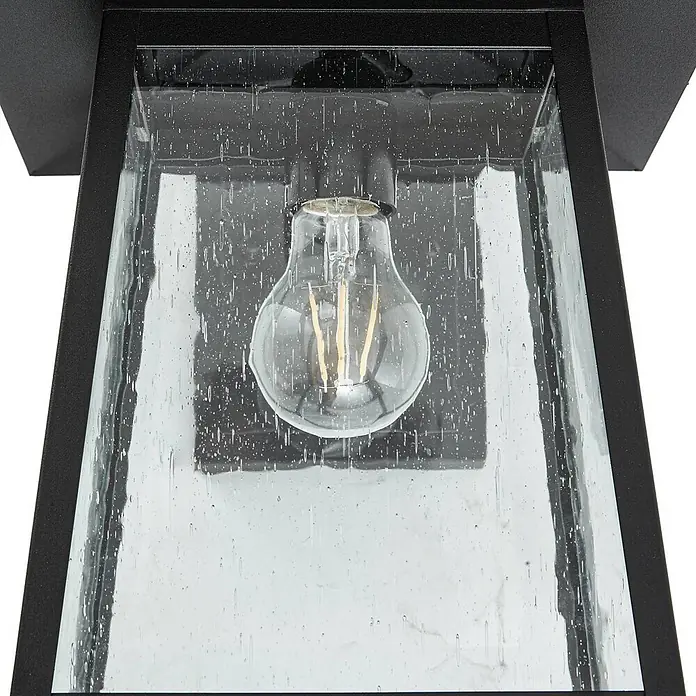 Lucande Außenwandleuchte Xavon - 28,2 x 24 x 38 cm, schwarz, schwarz, IP44 - Nahaufnahme einer schwarzen Außenleuchte mit Blasenglas und sichtbarer LED-Filamentbirne.