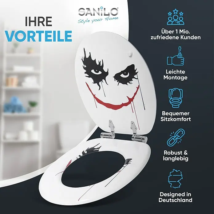 SANILO WC-Sitz Joker mit Absenkautomatik - MDF, Rot, Mit Absenkautomatik - Weißer Toilettensitz mit schwarzem und rotem Joker-Gesichtsdesign, geöffnet dargestellt.