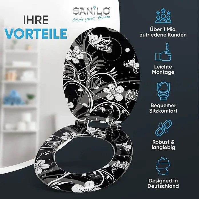SANILO WC-Sitz White Flower mit Absenkautomatik - MDF, Schwarz, Mit Absenkautomatik - Schwarzer Toilettensitz mit weißen Blumen- und Schmetterlingsmustern, offen gezeigt.