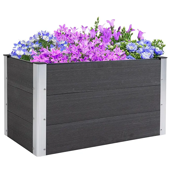 Furnicato Hochbeet - 100 x 50 x 55,5 cm, Verbundwerkstoff, Grau - Dunkelgrauer Pflanzkasten in Holzoptik mit silbernen Metallecken, gefüllt mit leuchtenden lila und blauen Blumen.