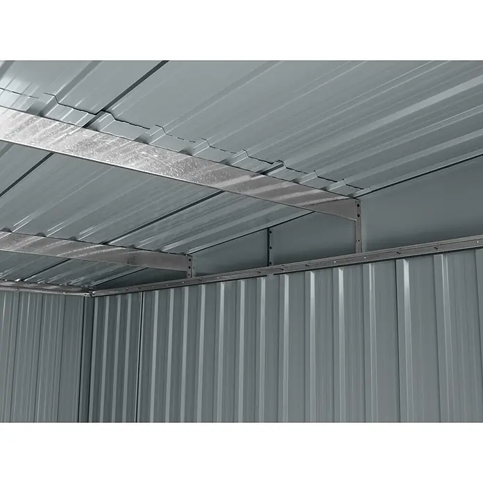 StarLine Metall Gerätehaus Lübeck 3,66 m² - Außenbreite inkl. Dachüberstand: 238 cm, Außentiefe inkl. Dachüberstand: 174 cm, Metall, Anthratit RAL 7016 - Innenansicht eines grauen Wellblechschuppens mit Dach, Seitenwand und verzinkten Stahlträgern.
