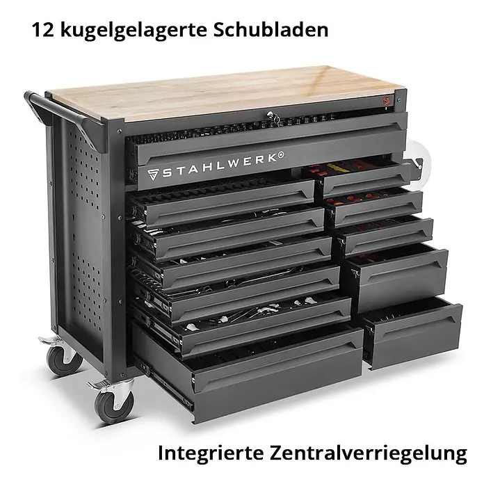 STAHLWERK Werkzeugkoffer Werkstattwagen DINO XXL Montagewagen -  - Dunkelgrauer mobiler Werkzeugschrank mit Holzplatte und offenen Schubladen voller Werkzeuge.