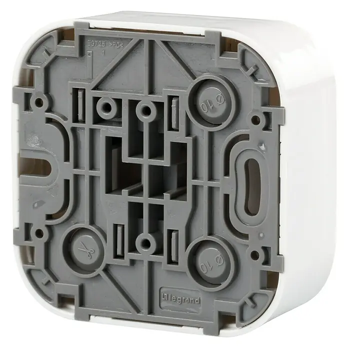 Legrand Forix Pulsador - Blanco, Montaje en superficie, 6 A - Vista detallada de la parte posterior de una caja de interruptor Legrand. La carcasa gris tiene orificios de montaje y marcas.