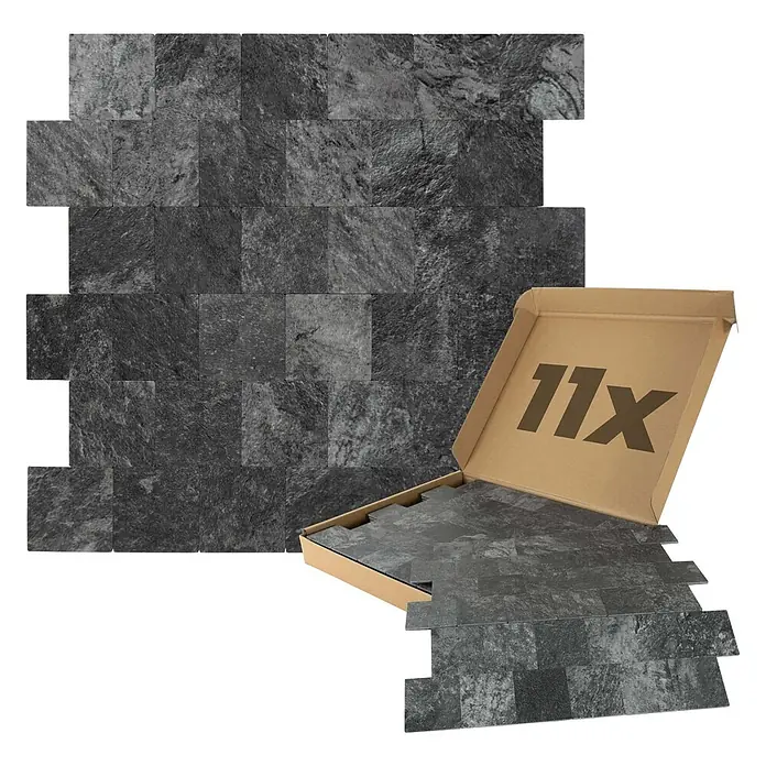 Dalsys Wandfliese 1m² Selbstklebende Fliesen Steinoptik 11 Stück Anthrazit - 30,6 x 30,6 cm, Anthracite - Dunkelgraue, texturierte Steinplatten, teils verlegt, teils in einem braunen Karton mit "11x".