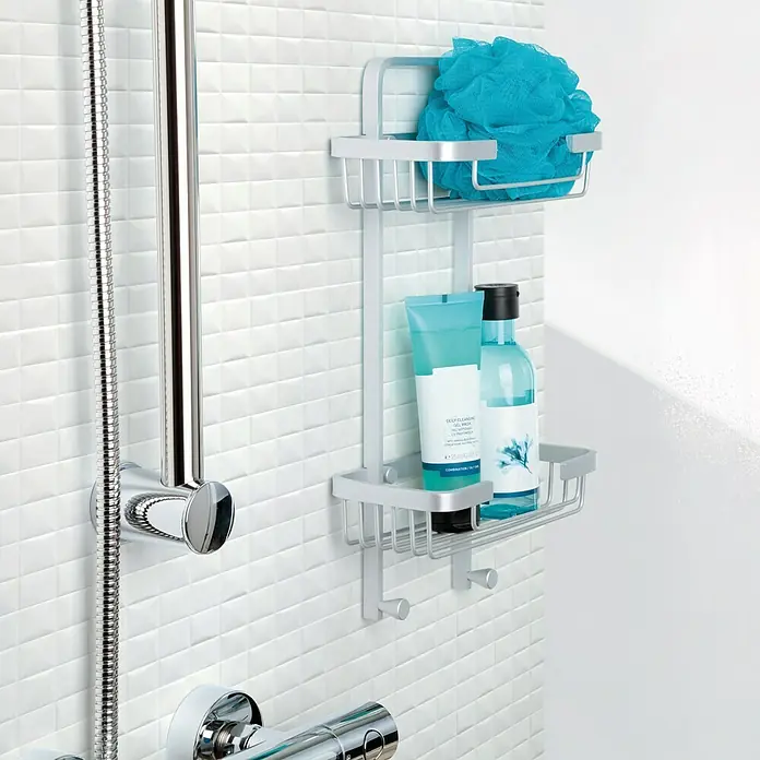 Tatay Cesta de baño doble Ice -  - Un moderno carrito de ducha plateado con dos estantes, ideal para guardar champú, gel de ducha y una esponja de baño en el baño.