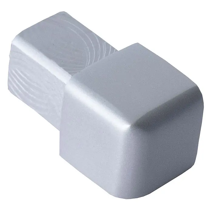 Dalsys Quadroprofil 10mm Endstück Quadratprofil Alu Silber matt, eloxiert - Aluminium, Silber - Silbernes L-förmiges Metalleckstück, ein Ende mit gebürsteter Textur, das andere glatt.
