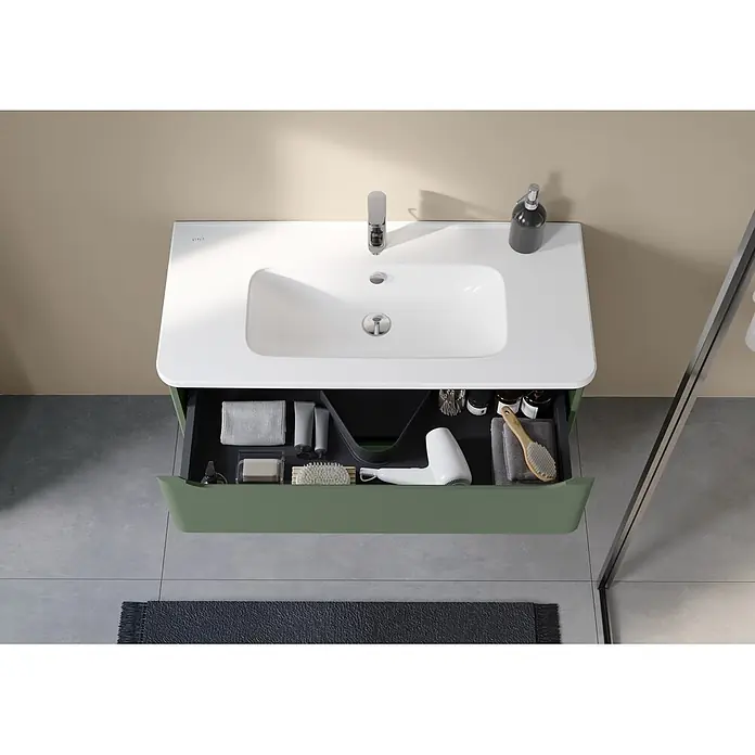 VitrA Integra Round Badmöbel-Set - Gesamtbreite Badmöbel: 100 cm, Moosgrün, Matt - Grüner Badunterschrank mit weißem Waschbecken und offener Schublade mit organisierten Pflegeprodukten.
