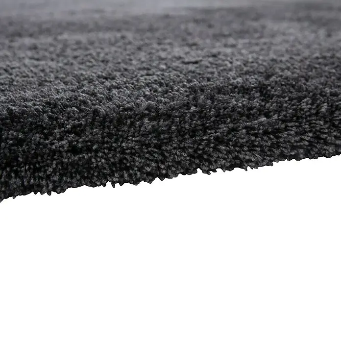 Hochflorteppich Super Soft ShaggyGraphit, 170 x 120 cm, 100 % Polyester (Flor) - Nahaufnahme eines dunkelgrauen Shaggy-Teppichs mit weicher Textur, ideal für Wohnräume.