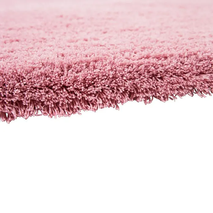 Hochflorteppich Super Soft Shaggy - Rosa, 110 x 60 cm, 100 % Polyester (Flor) - Nahaufnahme eines rosa Teppichs mit weichen, flauschigen Fasern, ideal für Komfort und Wärme im Raum.
