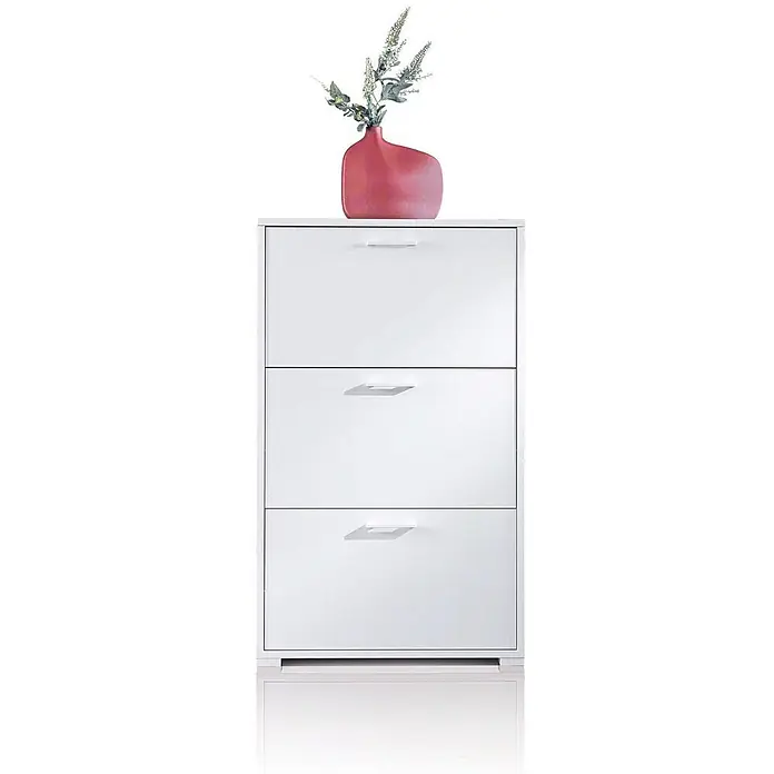 Kiamami Valentina Schuhschrank - L x B x H: 67 x 28 x 112 cm, Weiß - Weißer Schuhschrank mit drei Schubladen und integrierten Griffen, darauf eine pinke Vase mit Grünzeug.