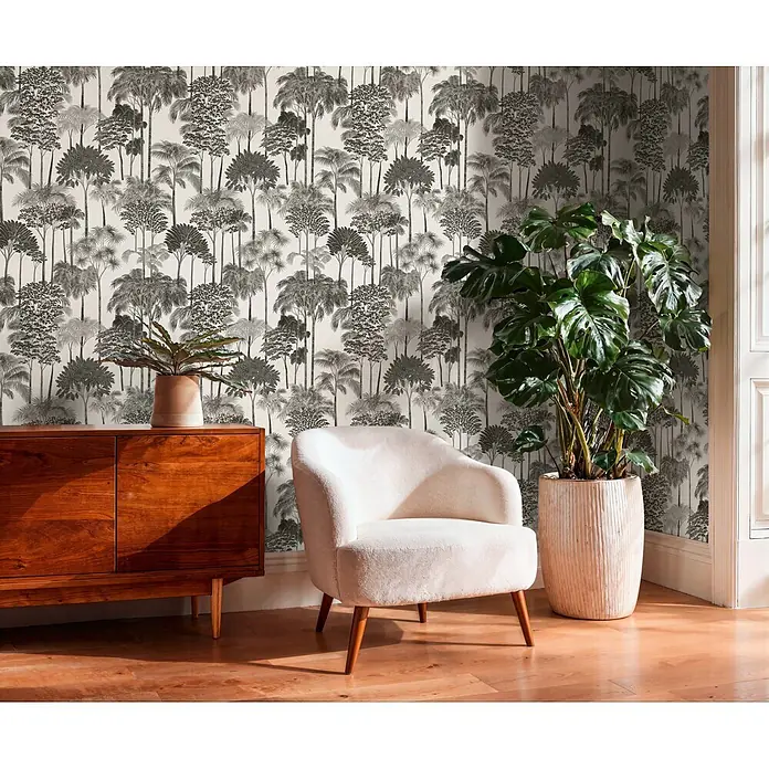 A.S. Création Cuba 2 Vliestapete Wald - Grau-Schwarz, Floral, 10,05 x 0,53 m - Schwarz-weiß gemusterte Tapete mit tropischem Waldmotiv an einer Zimmerwand.