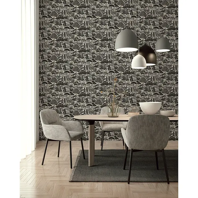A.S. Création Pintwalls 3 Vliestapete Natur - Grau-Schwarz, Floral, 10,05 x 0,53 m - Schwarz-weiß gemusterte Tapete mit Waldmotiv in einem modernen Esszimmer.