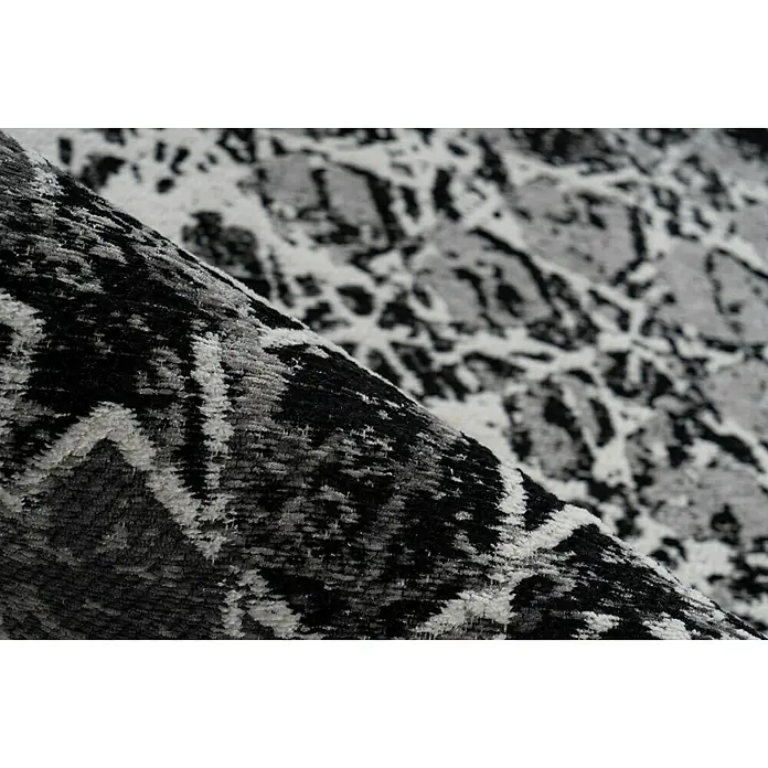 Kayoom Kurzflorteppich Iglesia - Grau, 170 x 120 cm, 100 % Polyester - Nahaufnahme eines modernen grauen Teppichs mit abstraktem Muster, ideal für zeitgenössische Wohnräume.