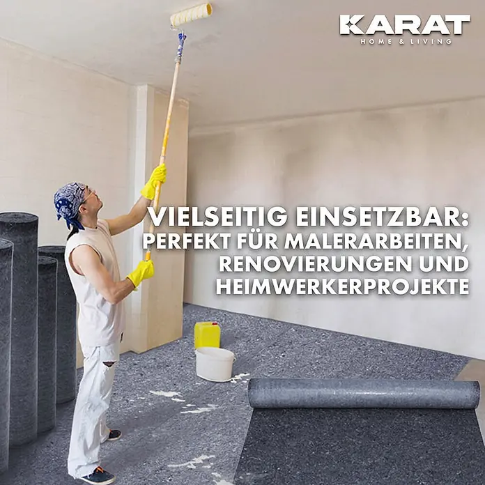 Floordirekt Abdeckvlies 180g/m² - Hochwertiger Schutzvlies für Malerarbeiten - 50 x 1 m - Dunkelgraues Bodenschutzvlies auf dem Boden während einer Renovierung ausgebreitet, Rollen sichtbar. Ideal für Maler- und Heimwerkerarbeiten.