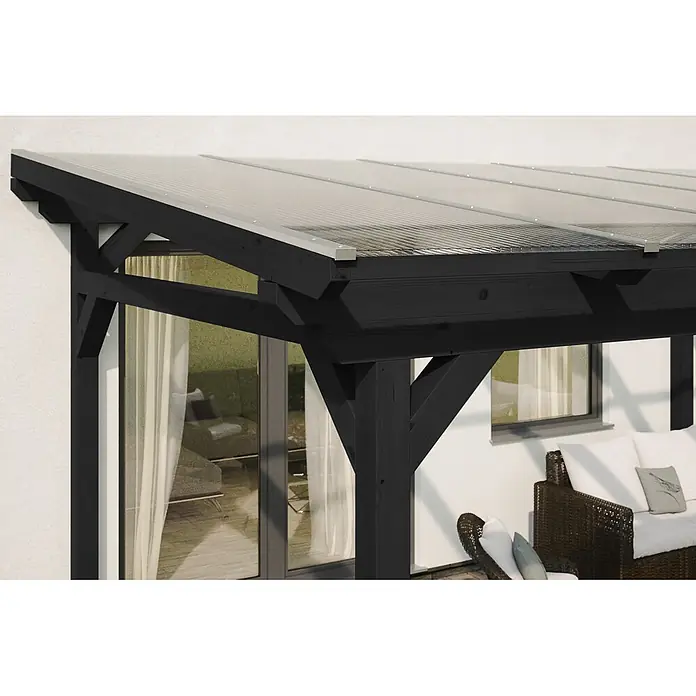 SKAN HOLZ Terrassenüberdachung Sanremo - B x T: 434 x 250 cm, Anthrazit, Polycarbonat, Transparent - Schwarzes Holz-Terrassendach mit lichtdurchlässigen Wellplatten aus Polycarbonat, an weißem Haus über Outdoor-Sitzbereich.