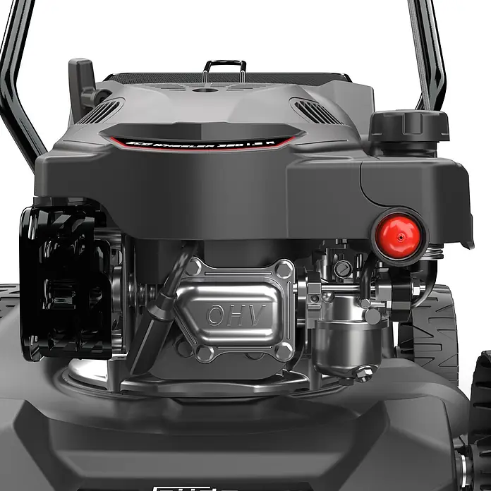 Güde Benzin-Rasenmäher Eco Wheeler 390 1,6 - 1,6 kW - 2 kW, 79,7 cm³, Schnittbreite: 390 mm - Nahaufnahme eines dunkelgrauen Rasenmähermotors mit roten Akzenten und silberner 'OHV'-Ventilabdeckung.