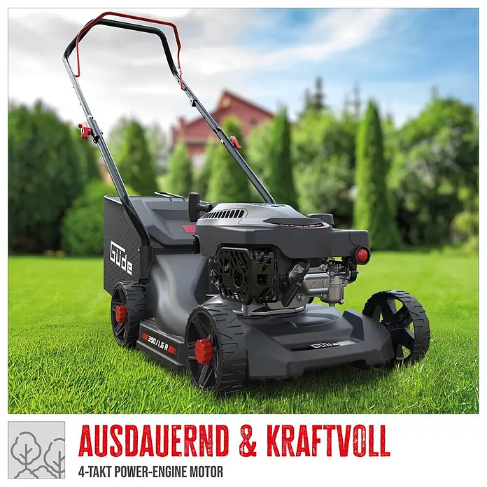 Güde Benzin-Rasenmäher Eco Wheeler 390 1,6 - 1,6 kW - 2 kW, 79,7 cm³, Schnittbreite: 390 mm - Ein grauer und schwarzer Güde Rasenmäher mit roten Akzenten steht auf grünem Gras im Garten, bereit zum Mähen.