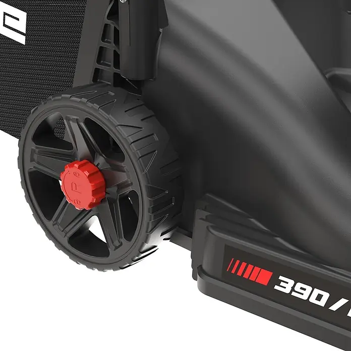 Güde Benzin-Rasenmäher Eco Wheeler 390 1,6 - 1,6 kW - 2 kW, 79,7 cm³, Schnittbreite: 390 mm - Schwarzes Rasenmäherrad mit roter Kappe, strukturierter Grasfangsack und Teil des Gehäuses mit „390“-Markierung.