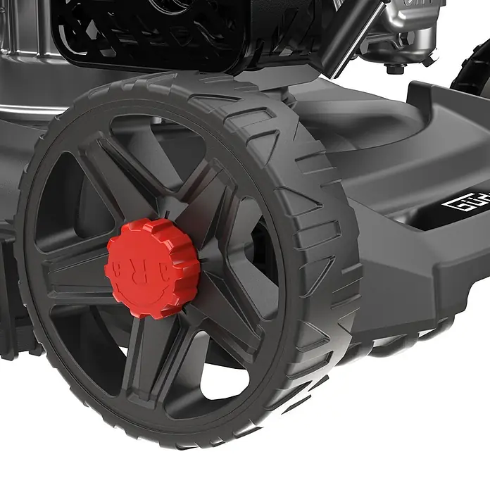 Güde Benzin-Rasenmäher Eco Wheeler 390 1,6 - 1,6 kW - 2 kW, 79,7 cm³, Schnittbreite: 390 mm - Schwarzes texturiertes Rasenmäherrad mit roter Radkappe, Motor- und Fahrgestellteilen.
