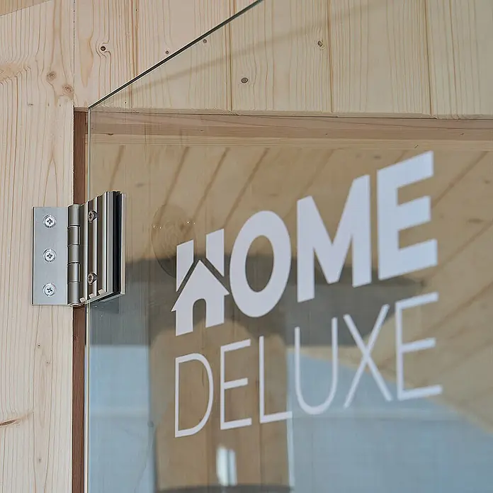Home Deluxe Fasssauna LAGOM DELUXE - Holzofen, Holz - Gebürstete Metallscharnier für Glastür, an einem Holzrahmen befestigt.