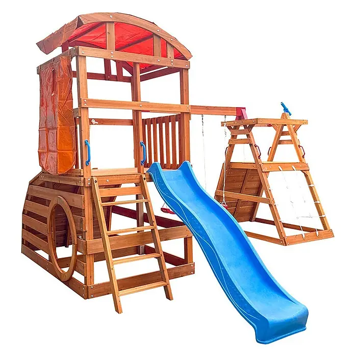 Home Deluxe Kinderspielturm NIA - L x B x H: 448,4 x 420 x 278,4 cm, Holz - Ein großer Holzspielplatz mit blauer Rutsche, rotem Dach, Kletterwand, Schaukeln und umzäuntem Tunnel-Spielbereich.