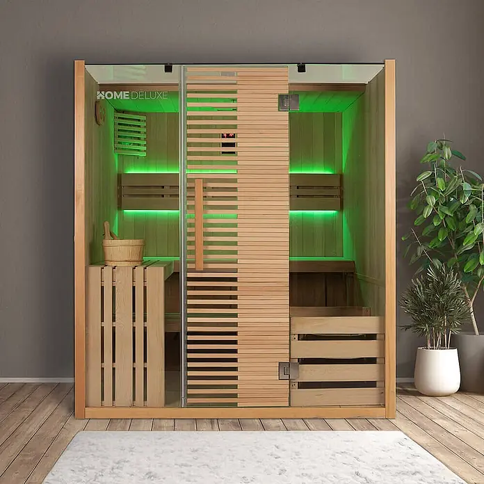 Home Deluxe Elementsauna OMAHA - Elektroofen, Steuerung Ofen: Integriert, L x B x H: 150 x 180 x 200 cm - Moderne Sauna aus hellem Holz und Glas mit grüner Innenbeleuchtung, Bänken und Holzzubehör.