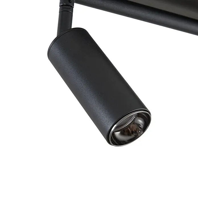 Lindby Deckenleuchte Eldrin - schwarz, schwarz - Matt schwarzer, zylindrischer Stromschienenstrahler mit reflektierender Chrom-Innenseite, an schwarze Schiene angeschlossen.
