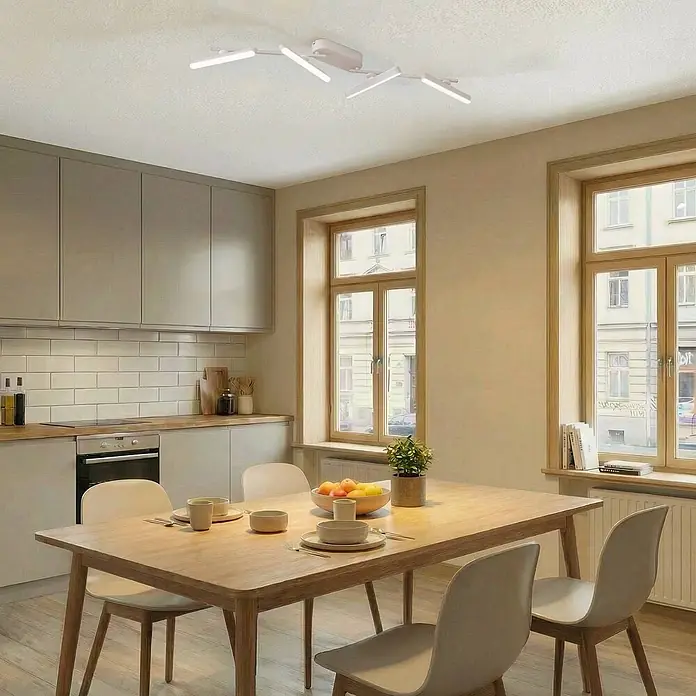 Lindby Deckenstrahler Eldrin - weiß / opal, weiß / opal - Eine weiße, moderne Deckenleuchte mit eckigen linearen Elementen beleuchtet einen Küchen- und Essbereich.