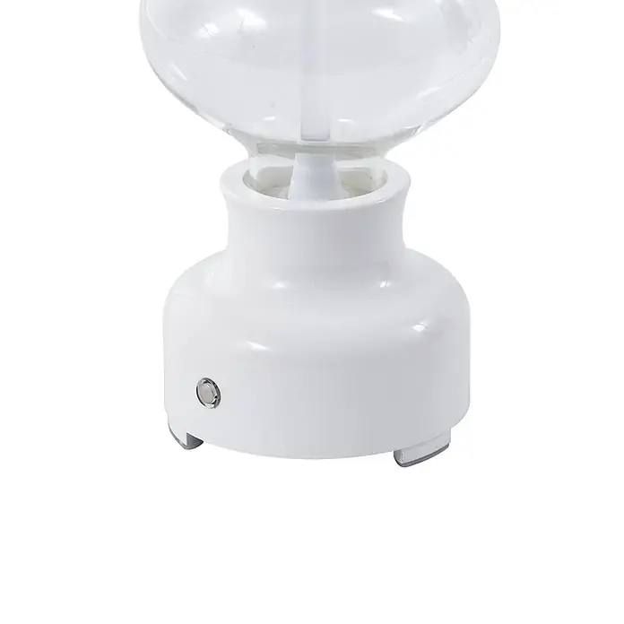 Lindby Tischleuchte Maxentius - L x B x H: 12 x 12 x 30 cm, creme / amber, klar / transparent - Weißer Keramiksockel eines Aromadiffusors mit klarem Glasaufsatz, seitlichem Knopf und kleinen Füßen.