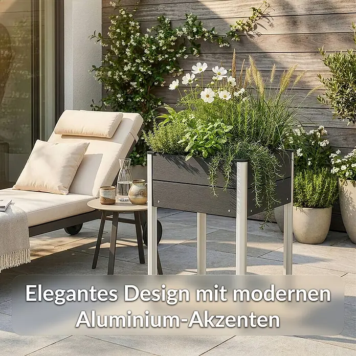 Floordirekt Hochbeet Salina - 60 x 50 x 90 cm, WPC, Anthrazit - Eleganter anthrazitfarbener Pflanzkasten mit modernen weißen Aluminiumbeinen, gefüllt mit verschiedenen Grünpflanzen und weißen Blüten, in einem Außenbereich.