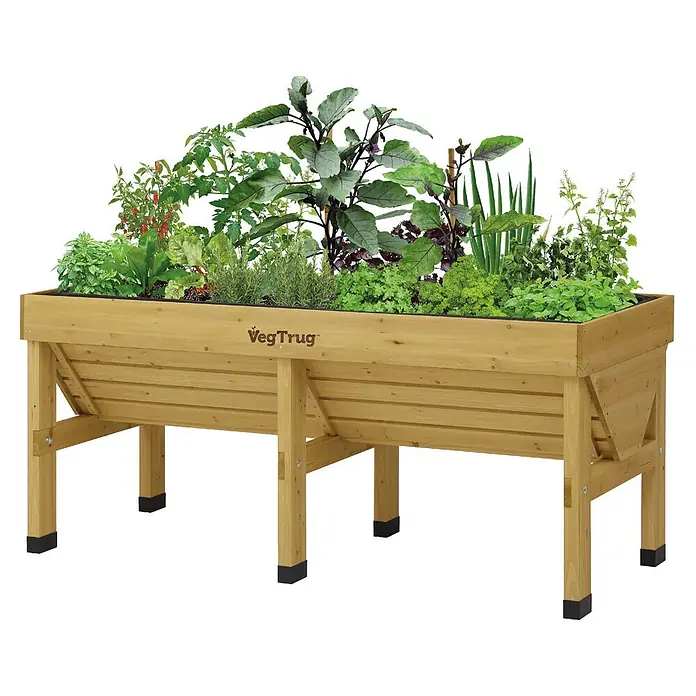 VegTrug Hochbeet Classic - Holz, Natur - Hölzernes Hochbeet, gefüllt mit verschiedenen grünen Pflanzen und Gemüse.