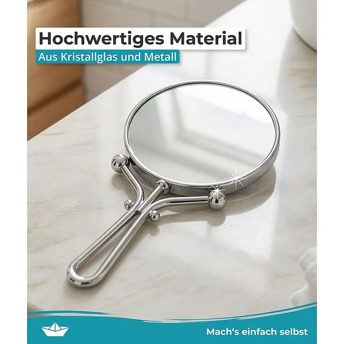 Calmwaters Kosmetikspiegel - Durchmesser: 12,7 cm, Rund, Chrom, Vergrößerung 1: 500 % - Eleganter runder Handspiegel aus poliertem Metall und Kristallglas auf einer hellen Arbeitsplatte.