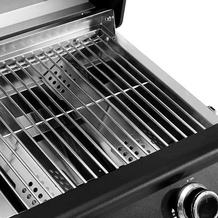 TAINO Gasgrill PLATINUM COMPACT - 2,2 kW, Anzahl Brenner: 2 Stk. - Edelstahlroste und Hitzeschutzplatten im Inneren eines Gasgrills, mit sichtbarem schwarzem Bedienfeld und Knopf.