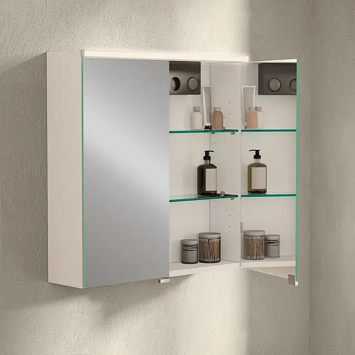 VitrA LED-Spiegelschrank - B x H: 60 x 62 cm, Mit Beleuchtung, Weiß - Offener Spiegelschrank mit Spiegeltür, Beleuchtung, Glasablagen mit Flaschen/Behältern, an texturierter Wand.