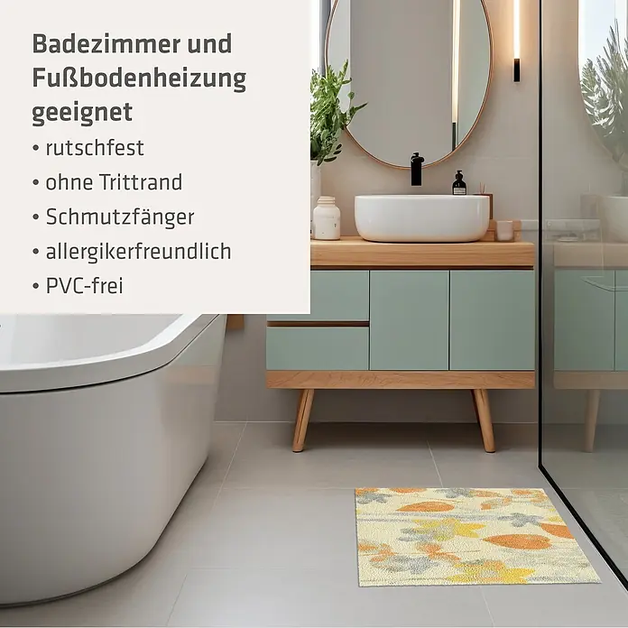 Akzente Fußmatte Feel - Mehrfarbig, Motiv / Muster|Floral - Eine helle Badematte mit abstrakten gelben, orangefarbenen und grauen Mustern auf einem Badezimmerboden.
