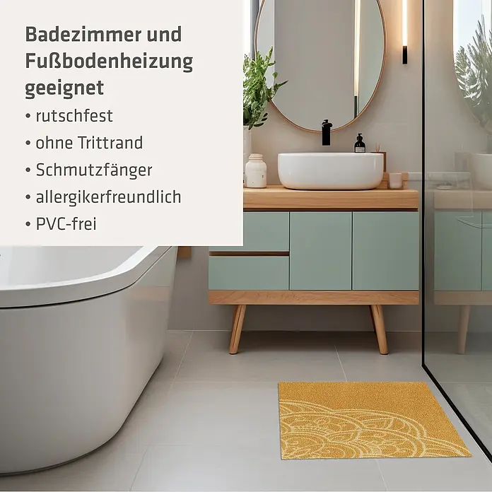 Akzente Fußmatte Feel - Mehrfarbig, Motiv / Muster - Gelbe Badematte mit Muster auf dem Boden eines Badezimmers neben Badewanne und Waschtisch.
