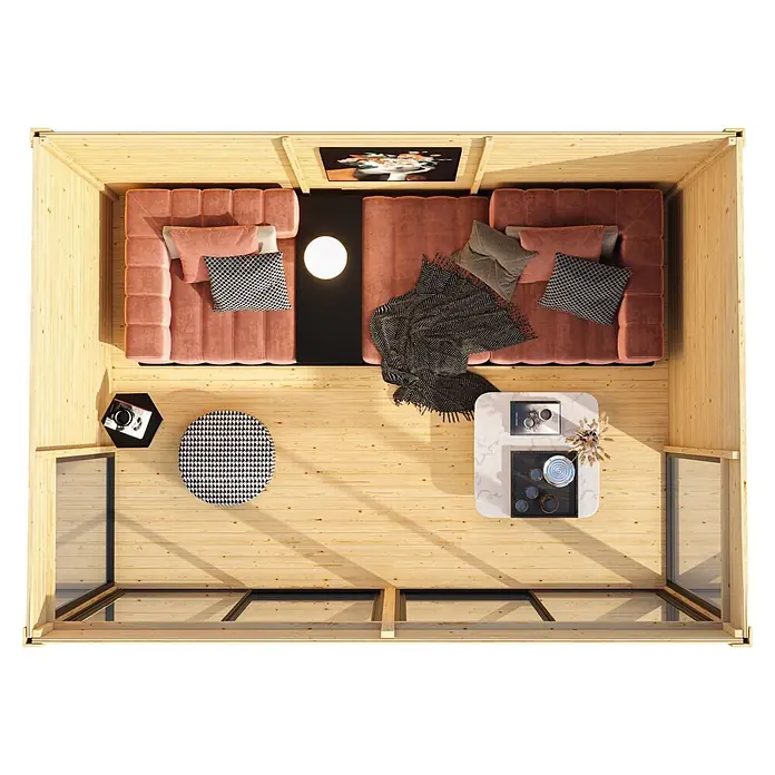 Karibu Gartenhaus Dice 5 - Außenmaß inkl. Dachüberstand (B x T): 471 x 330 cm, Holz, Naturbelassen - Draufsicht auf ein Blockhütten-Wohnzimmer mit zwei rosa Sofas, Couchtischen und großen Fenstern.