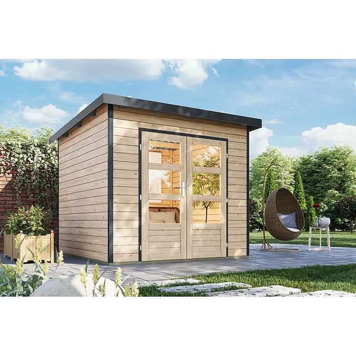 Karibu Gartenhaus Pluto 3 A - Außenmaß inkl. Dachüberstand (B x T): 267 x 266 cm, Holz, Naturbelassen/Anthrazit - Holzgartenhaus mit dunklem Dach und Türrahmen, auf einer Terrasse in einem Garten stehend.