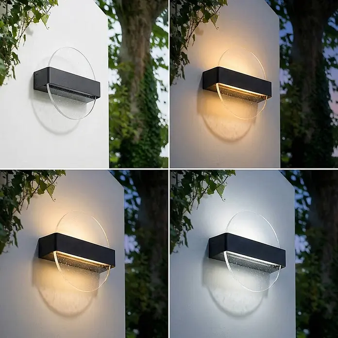 Lucande Außenwandleuchte Narkelo - schwarz, klar / transparent, IP44 - Schwarze rechteckige Außenwandleuchte mit klarem, strukturiertem Glasdiffusor, beleuchtet eine Wand mit einstellbarem warmem bis kühlem Licht.