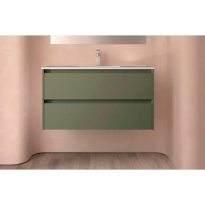 Salgar Badmöbel-Set Salgar - Gesamtbreite Badmöbel: 4,5 cm, Green Satin - Salbeigrüner Badezimmerschrank mit zwei Schubladen und integriertem Waschbecken, an einer rosa Wand montiert.