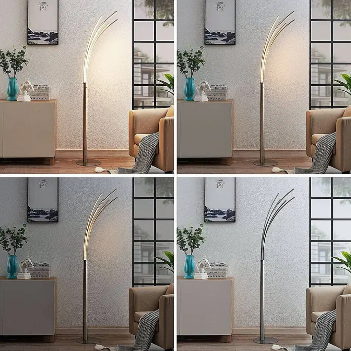 Lindby Stehleuchte Boba - Höhe: 185 cm, alu / grau / zink, alu / grau / zink - Moderne LED-Stehleuchte aus gebürstetem Nickel mit geschwungenen Lichtleisten, beleuchtet ein Wohnzimmer.