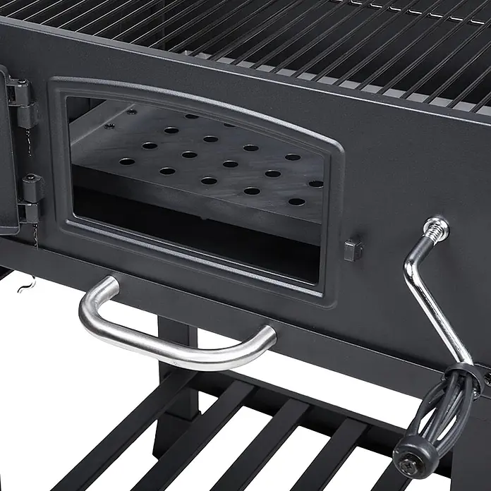 TAINO Holzkohlegrill HERO XL - Schwarz - Dunkelgrauer Holzkohlegrill mit Frontklappe, perforierter Kohleschale, seitlicher Höhenverstellung und silbernem Griff.