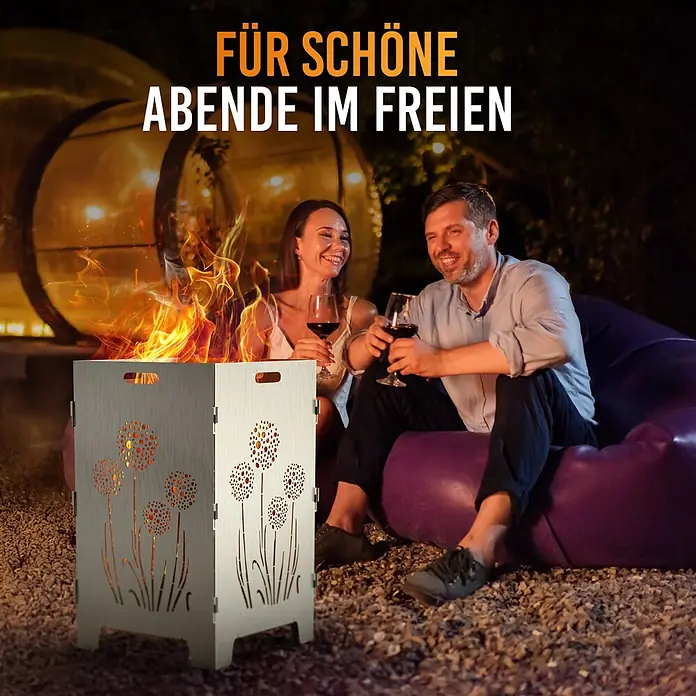 TiKo-Design Holzkohlegrill Feuerkorb-Pusteblumen - Durchmesser Grillfläche: 60 cm, Grau - Metallene Feuerschale mit dekorativen Pusteblumen-Ausschnitten, erhellt einen Abend im Freien.