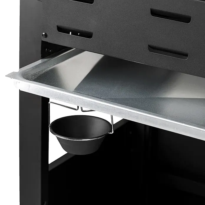 TAINO Gasgrill RED 6+1 -  - Eine Abtropfschale aus Metall mit einer hängenden schwarzen Schüssel, befestigt an einem schwarzen Smoker- oder Grillteil.