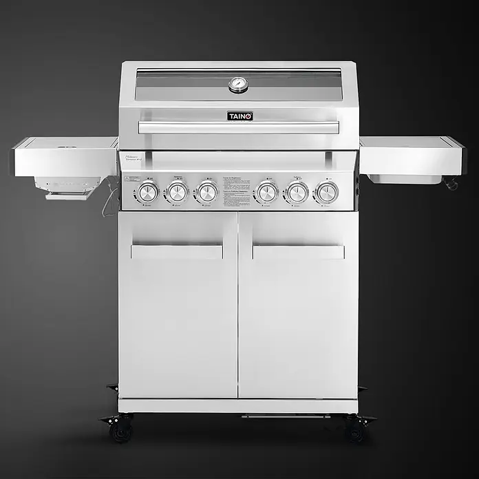 TAINO Gasgrill PLATINUM YAMARA 4+2 - Anzahl Brenner: 4 Stk. - TAINO Platinum Yumeuera 4+2 Gasgrill aus Edelstahl mit silberner Oberfläche, Bedienknöpfen, Seitenablagen und Temperaturanzeige, auf Rollen.