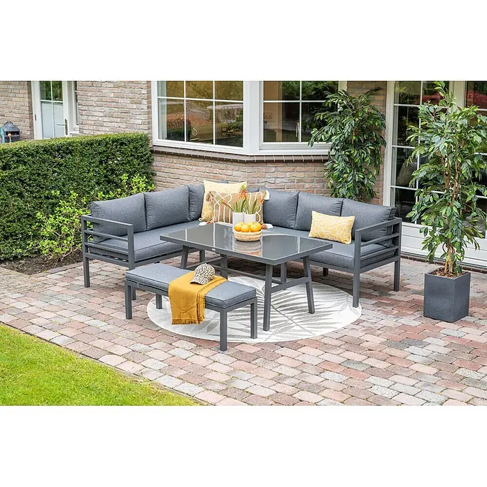 Garden Impressions Loungemöbel-Set Bleco II - 4 -tlg., Aluminium, Anthrazit/Schwarz - Dunkelgraues Outdoor-Loungeset mit Kissen, Tisch und Bank auf einer Terrasse.